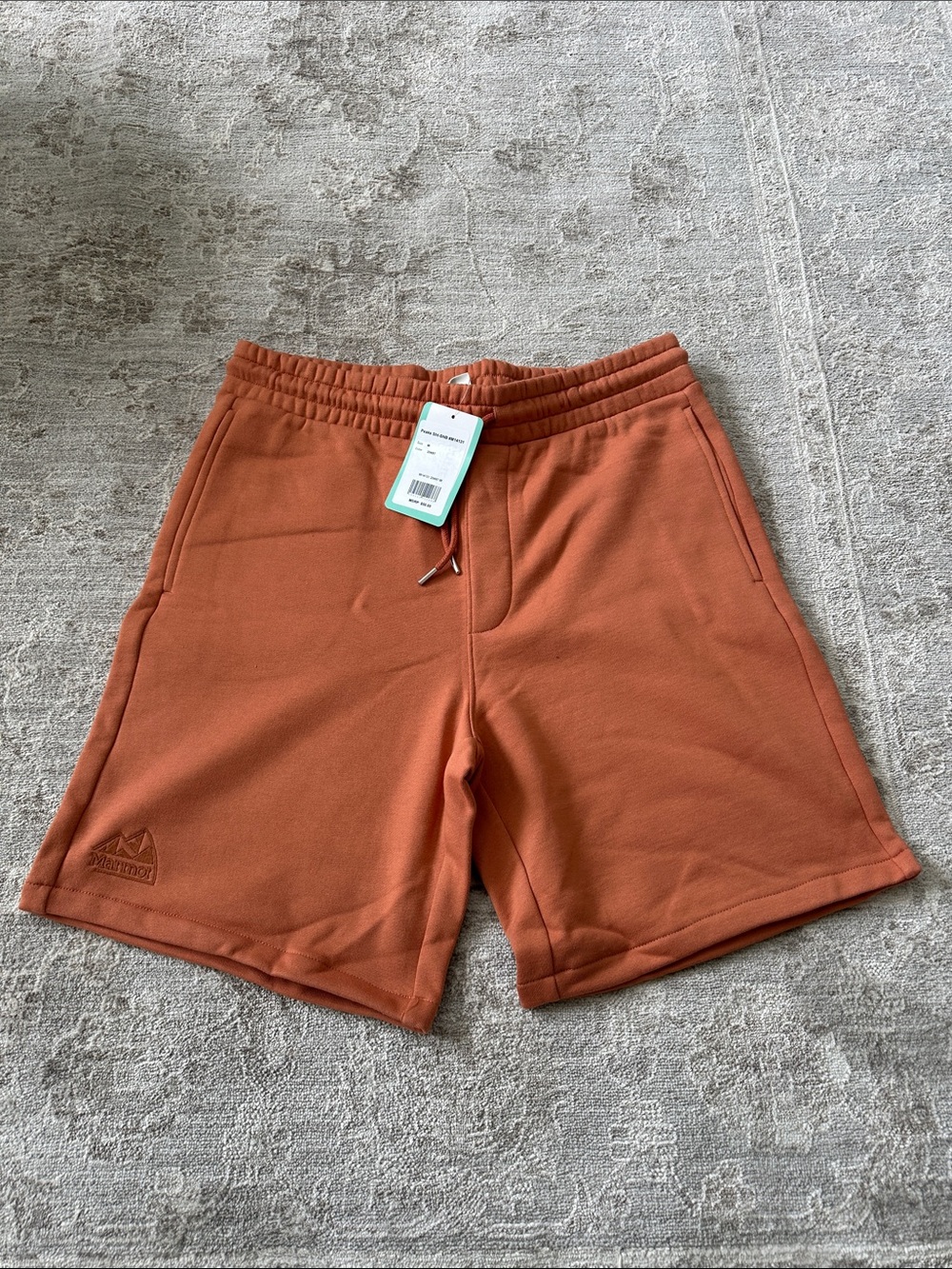 Marmot Men's Medium Rust Orange colored Athletic Peak Shorts. NWT’s.
